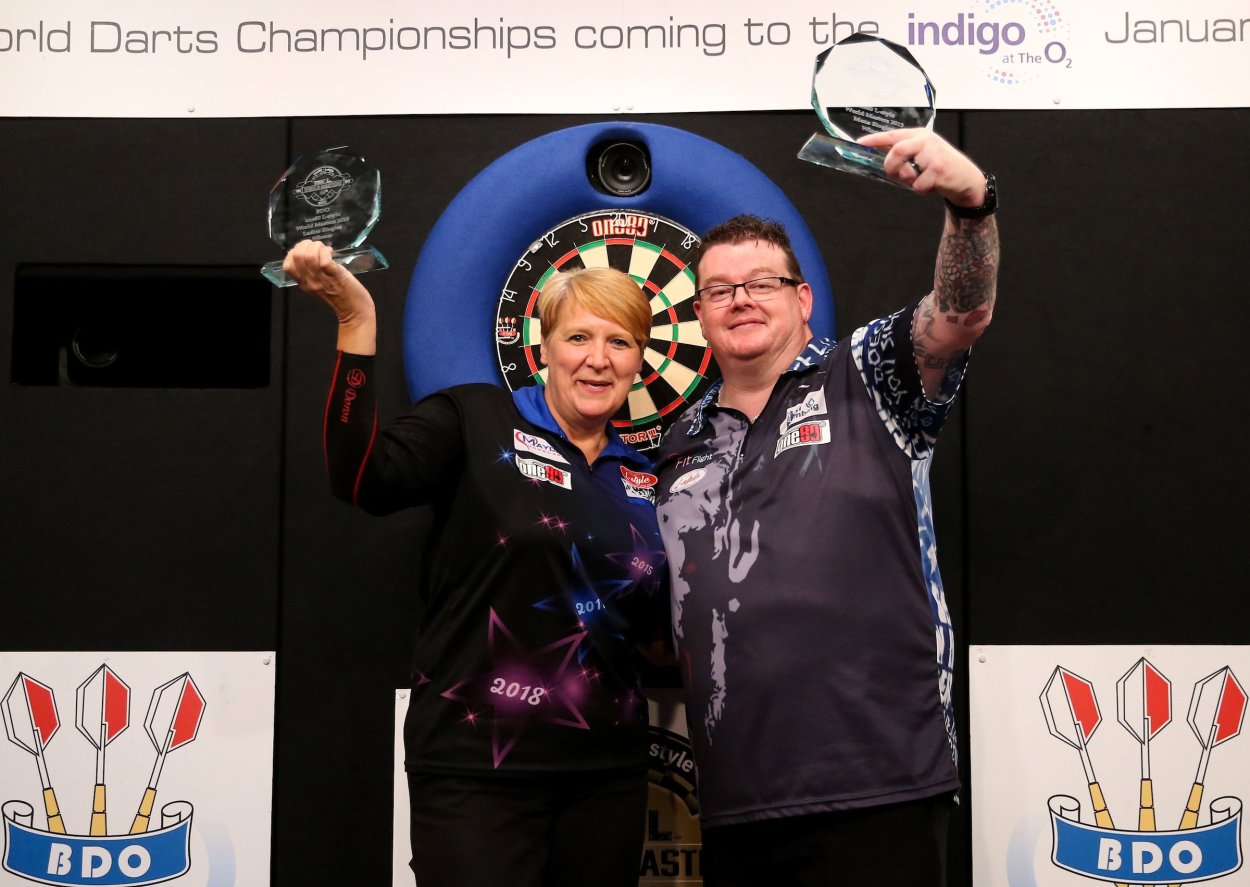 Игрок в дартс